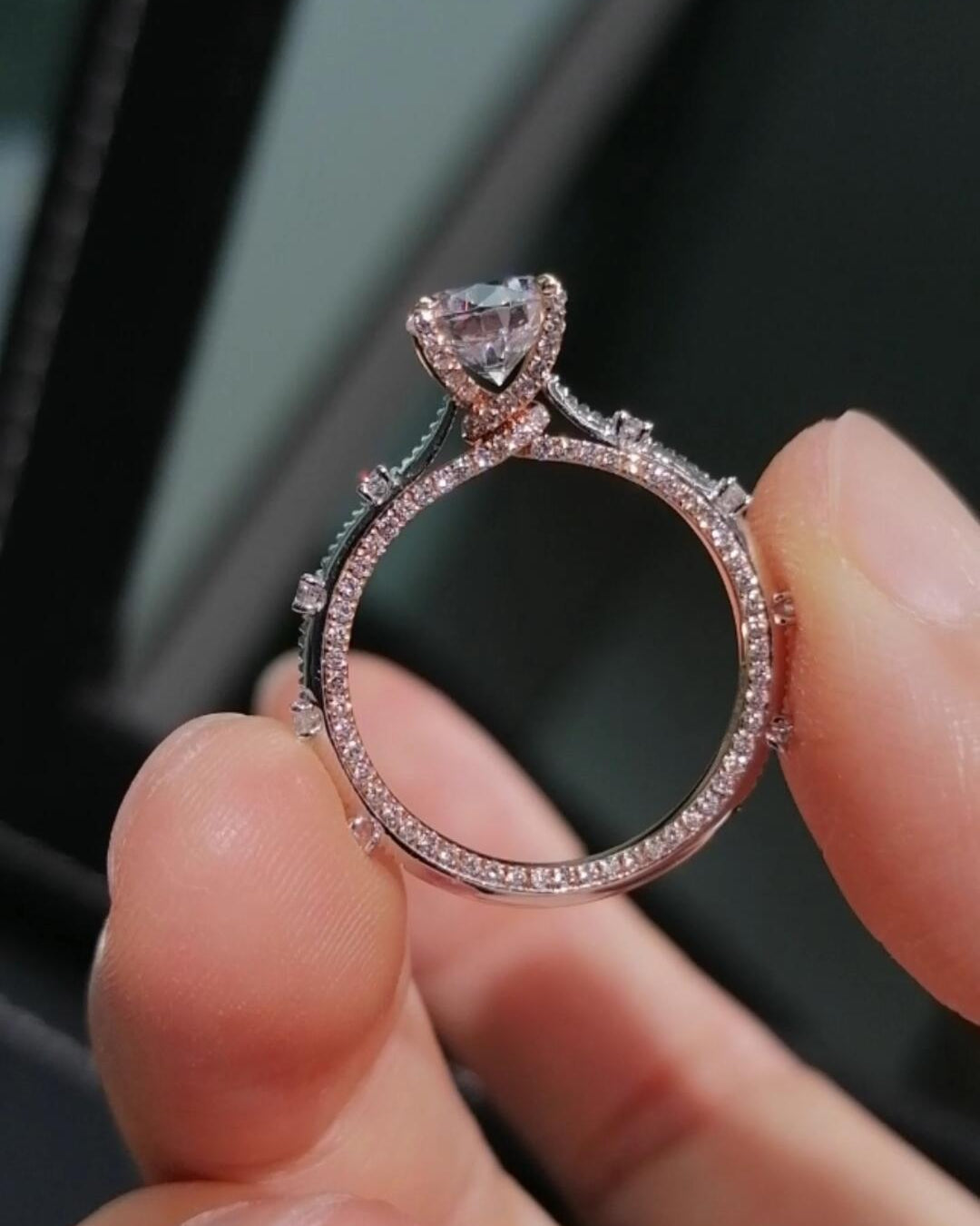 Two-tone band design with pavé-set diamonds; round lab-grown diamond in a four-prong setting, Color D, Clarity VS1.