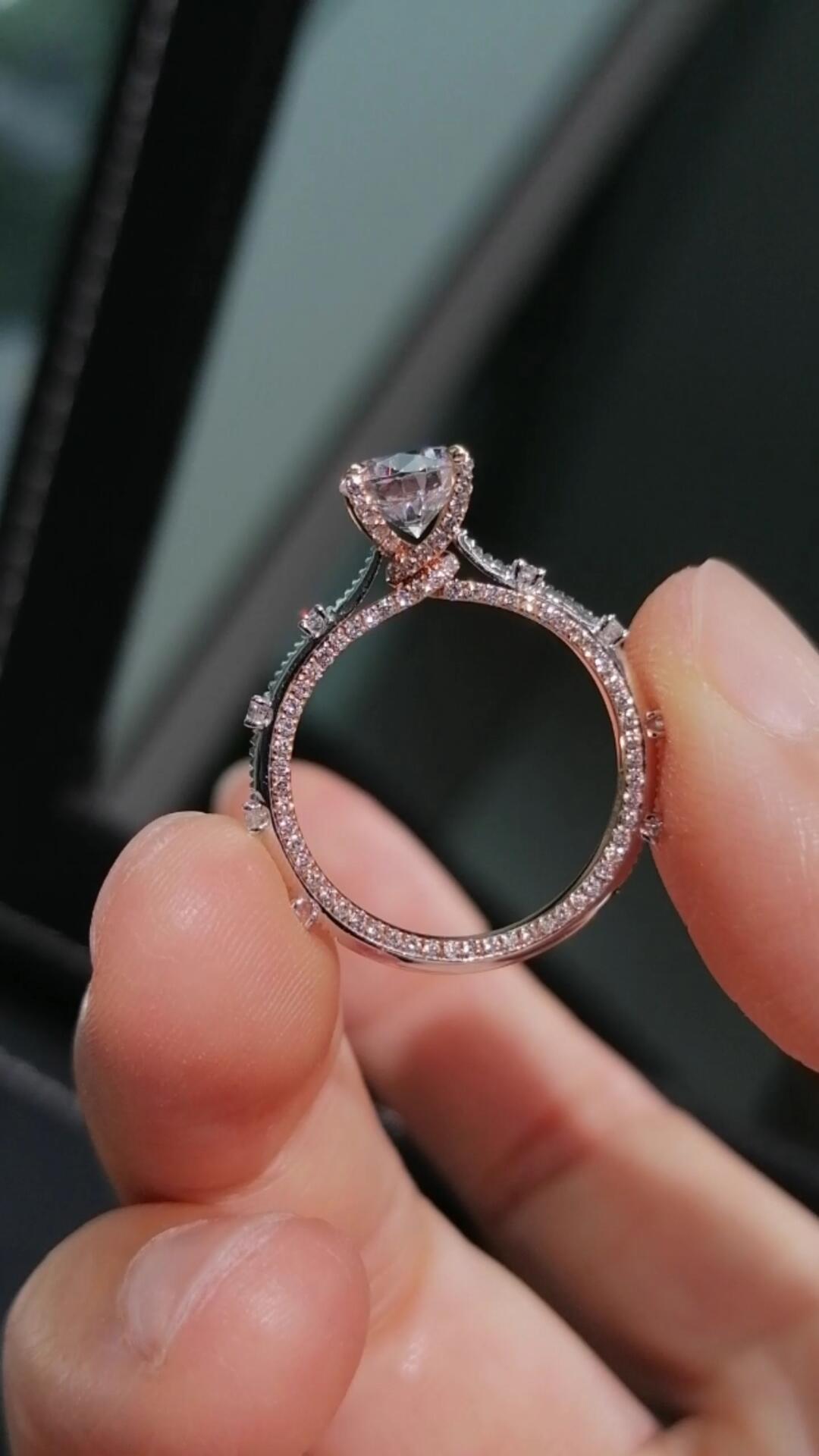 Two-tone band design with pavé-set diamonds; round lab-grown diamond in a four-prong setting, Color D, Clarity VS1.