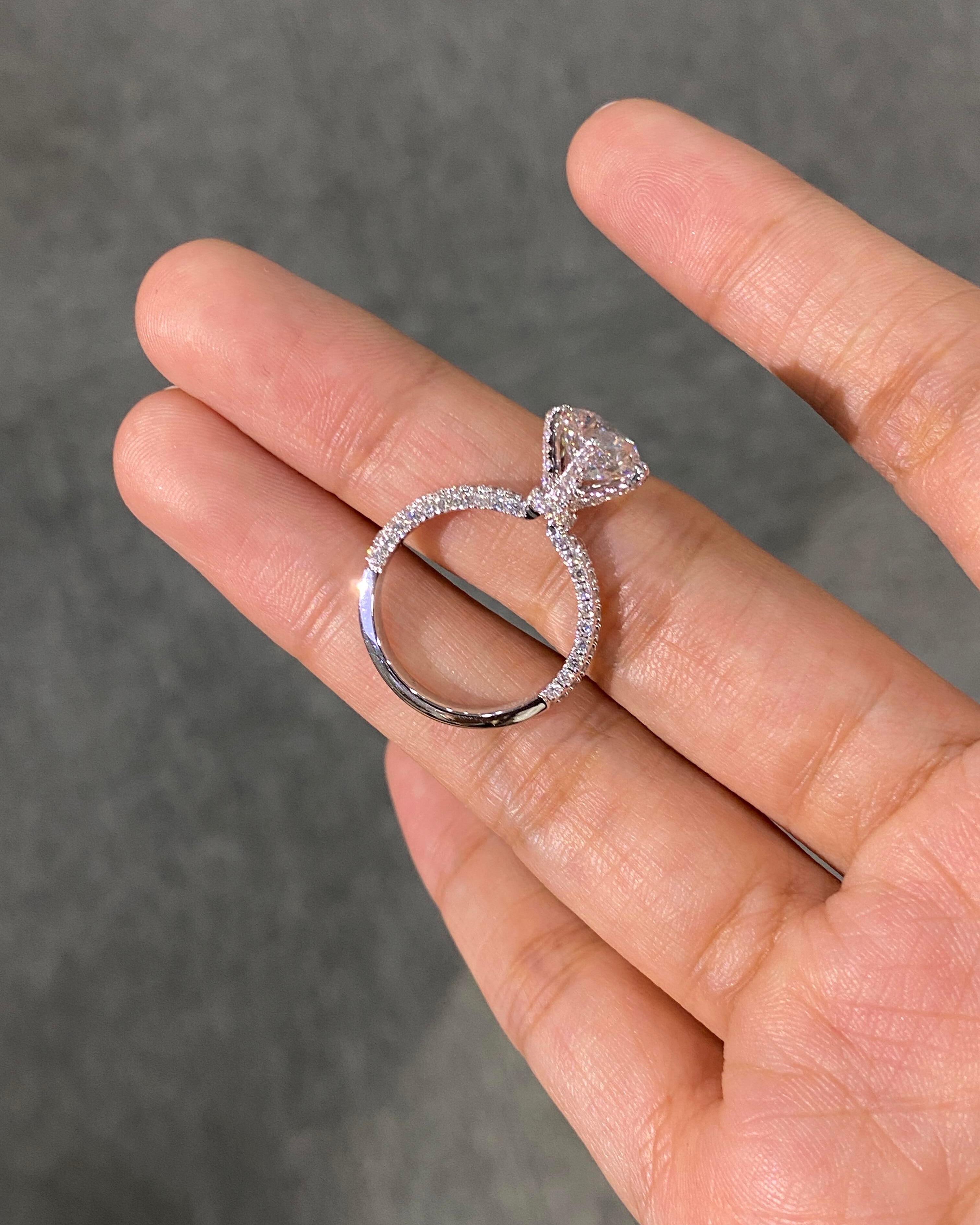 Four-Prong Set, Round Lab-Grown Diamond Ring—Radiating Brilliant Luster, Featuring D Color and VS1 Clarity.